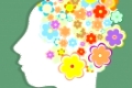 silhouette of a woman's head filled with cute flowers. vector